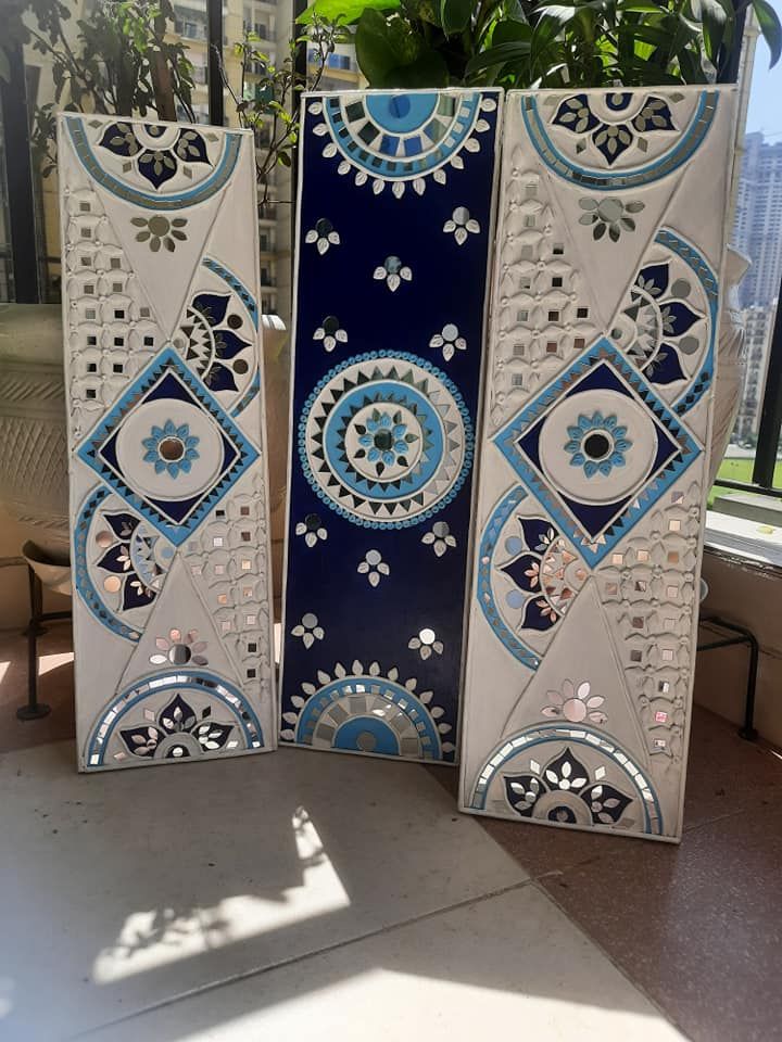 two blue and white vases sitting next to each other on a window sill