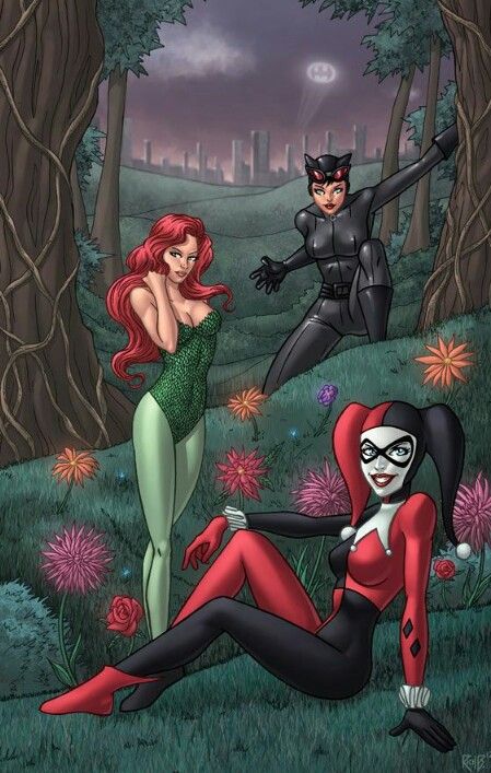 two women dressed as batman and catwoman in the woods with flowers on the ground