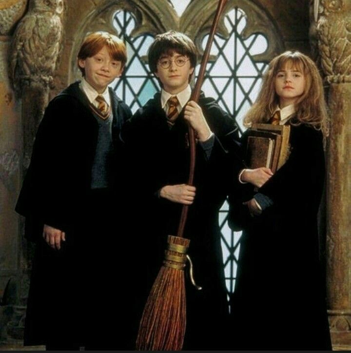 three harry potters standing in front of a window