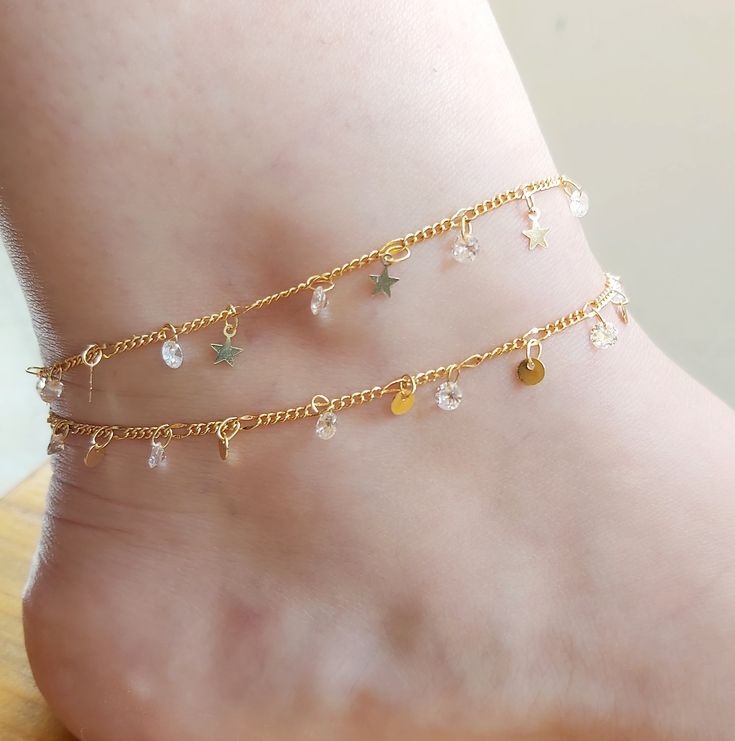 Super cute Pearl Anklet that you will seriously loveee. Effortless, yet adds lots of sparkles and perfect for foot everyday. Makes the PERFECT gift for self or someone awesome. THE PERFECT GIFT 14KT GOLD PLATED Stainless steel GEMSTONE Zircon stone - Each order would be individually gift-wrapped :) - Meticulously handcrafted especially for you! Gold Delicate Anklet For Gift, Delicate Gold Anklets As Gift, Delicate Gold Anklet For Gift, Delicate Gold Bracelets For Summer, Handmade Gold Anklets For Summer, Trendy Gold Anklet With Adjustable Chain, Adjustable Dangle Anklets With Chain, Delicate Gold Anklet With Adjustable Chain, Gold Party Bracelet Anklets