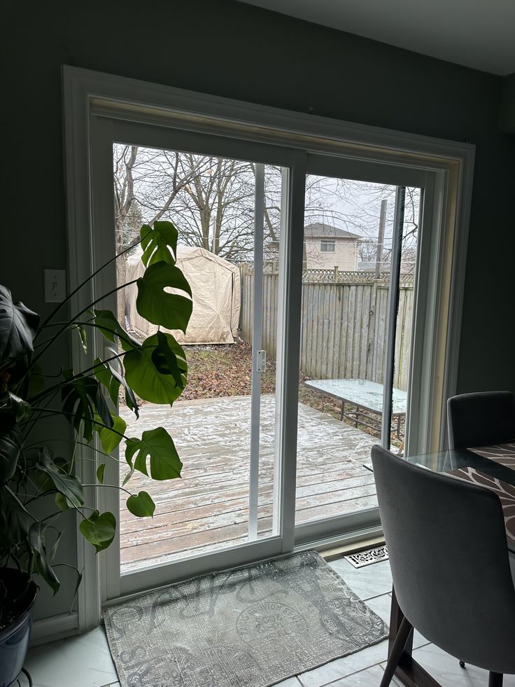 a dining room with sliding glass doors leading outside