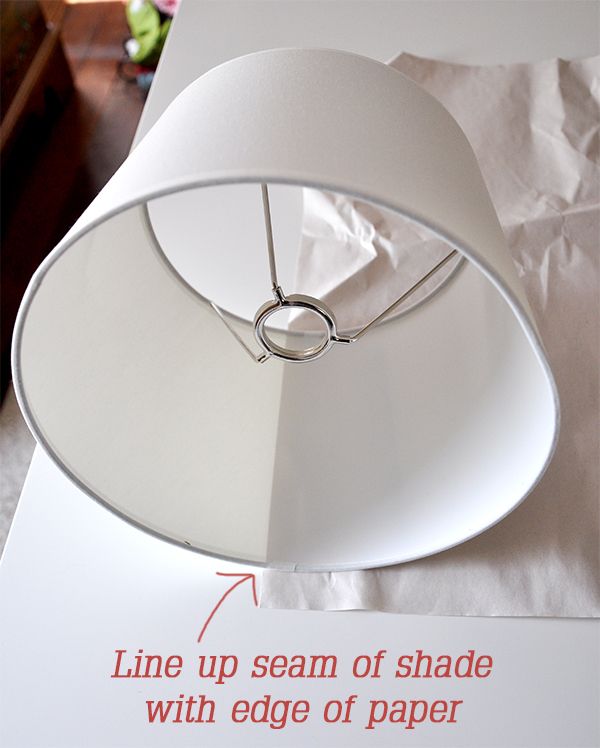 a lamp shade with edge of paper attached to it and instructions on how to install