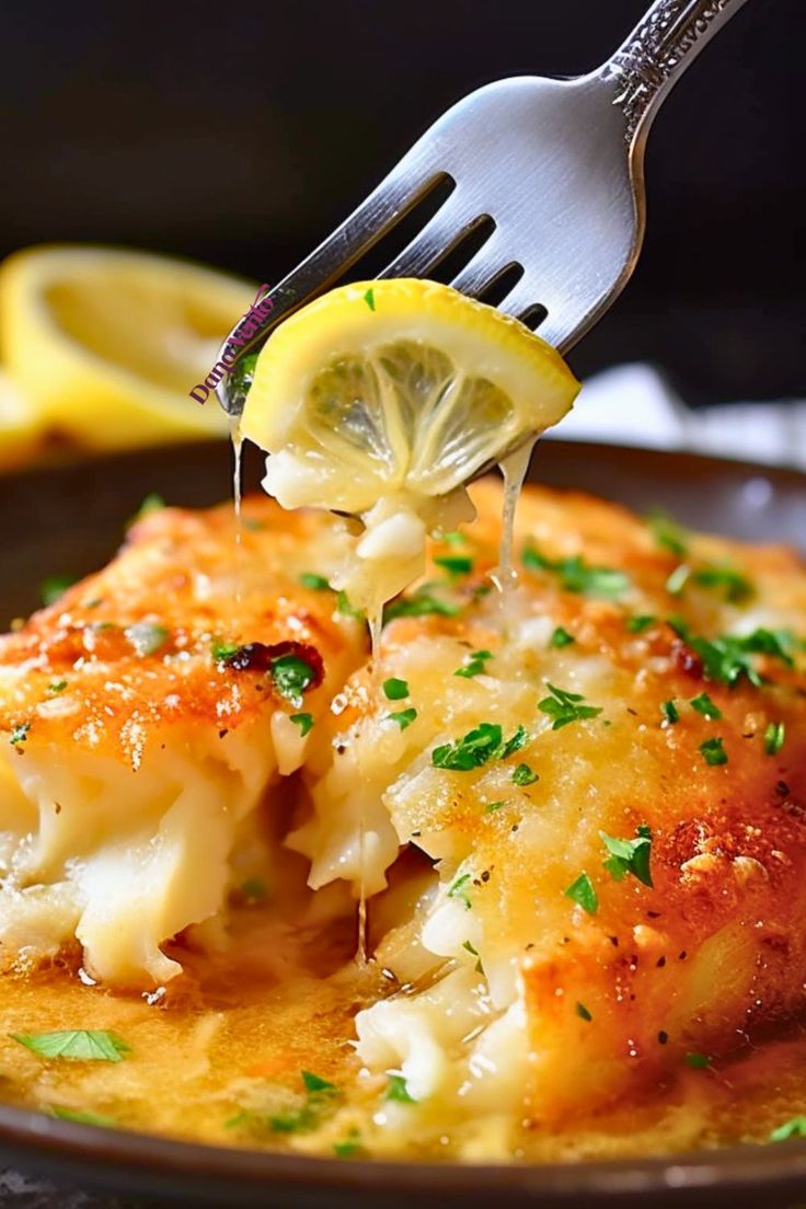 a fork with some food on it that is being lifted from the plate by a fork