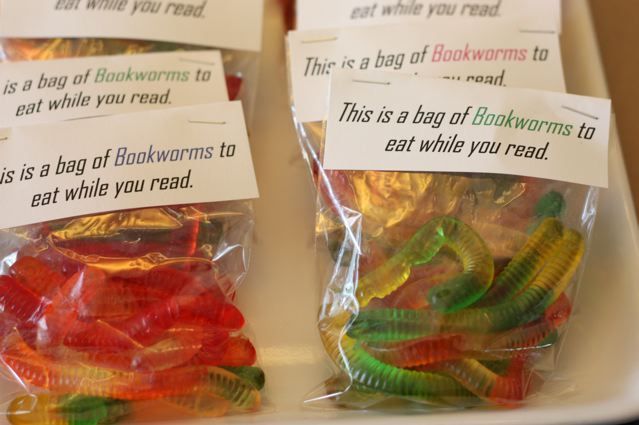 some gummy bears are in plastic bags on a tray with labels that say, this is a bag of rainbows to eat while you read