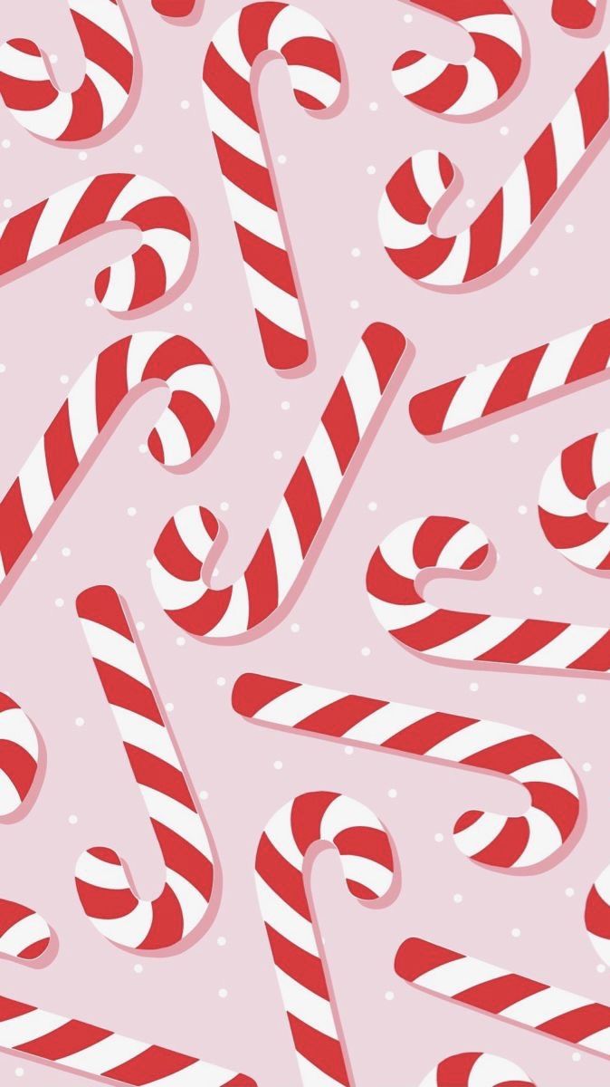 pink christmas wallpaper with red and white candy canes