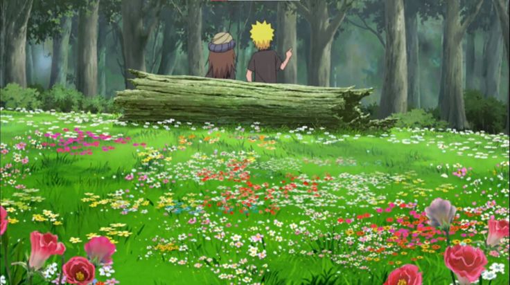 two people sitting on a log in the middle of a field with flowers and trees