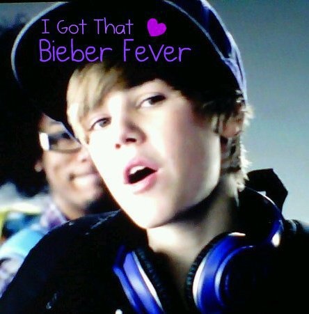 a young boy wearing headphones with the words i got that bieber fever on it