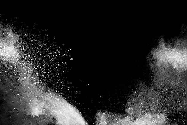 black and white photograph of snow being thrown into the air