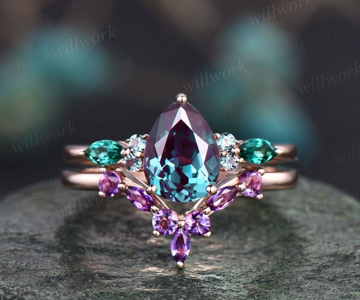 - Metal: Solid gold(10K/14K/18K white/yellow/rose gold),925 sterling silver,platinum available- Main Stone: 6x8mm pear cut Lab treated Alexandrite- Accent Stone: 2x4mm marquise cut lab-treated emeralds and 1.5mm round Alexandrites- Wedding Band Stone: 2mm round and1.5x3mm marquise amethysts- Band Width: 1.4mm- Can be personalized: Yes Amethyst Wedding Band, Wedding Ring Sets Unique, Art Deco Emerald, Art Deco Emerald Ring, Wedding Band Unique, Unique Wedding Ring, Amethyst Wedding, Earth Mother, Cute Engagement Rings