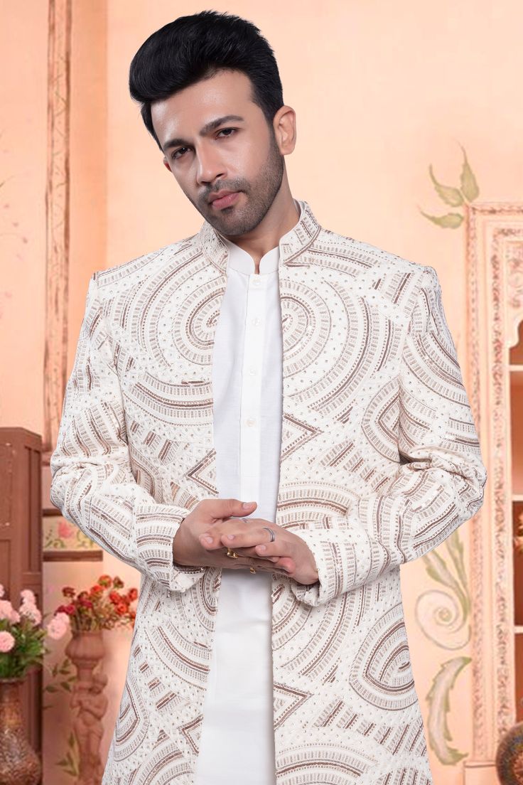 The U2-S404 Sherwani is the perfect combination of traditional and modern. Its open jacket design is adorned with intricate thread, stone, and sequin embroidery for a trendy, yet classic look. Make a statement at any event with this unique and stylish piece. Formal Bollywood Nehru Jacket With Chikankari Embroidery, Bandhgala With Naqshi For Reception, Designer Nehru Jacket With Intricate Embroidery For Reception, Bollywood Style Outerwear With Chikankari Embroidery For Wedding, Traditional Fitted Blazer With Zari Work, Fitted Traditional Blazer With Zari Work, Designer Nehru Jacket With Dabka Work For Reception, Festive Traditional Blazer With Zari Work, Bollywood Style Outerwear For Eid Reception