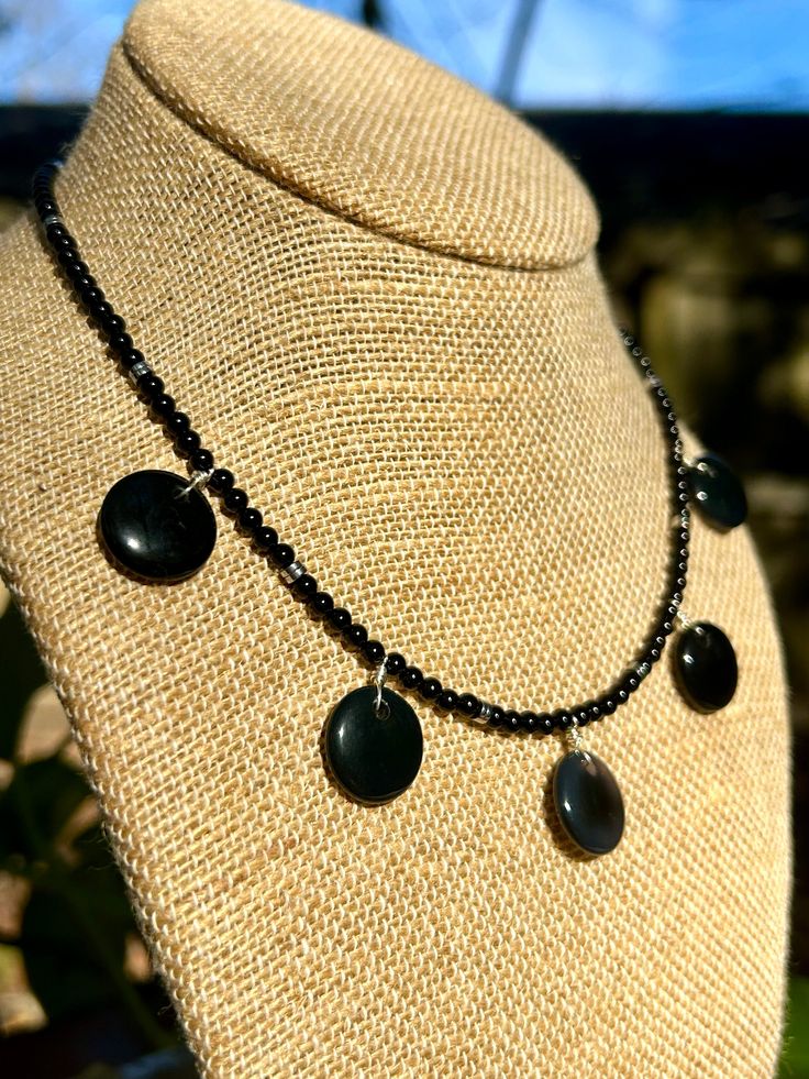 Beaded black onyx & black agate discs choker necklace with barrel twist clasp Matching black onyx & black agate sterling silver earrings Black Onyx Jewelry With Black Beads, Black Gemstone Round Beads Jewelry, Black Gemstone Beads Jewelry, Black Onyx Jewelry With Polished Beads, Black Onyx Beads Jewelry, Round Onyx Bead Jewelry, Onyx Round Beads Jewelry, Round Onyx Gemstone Beads Jewelry, Black Jewelry With Natural Stone Round Beads