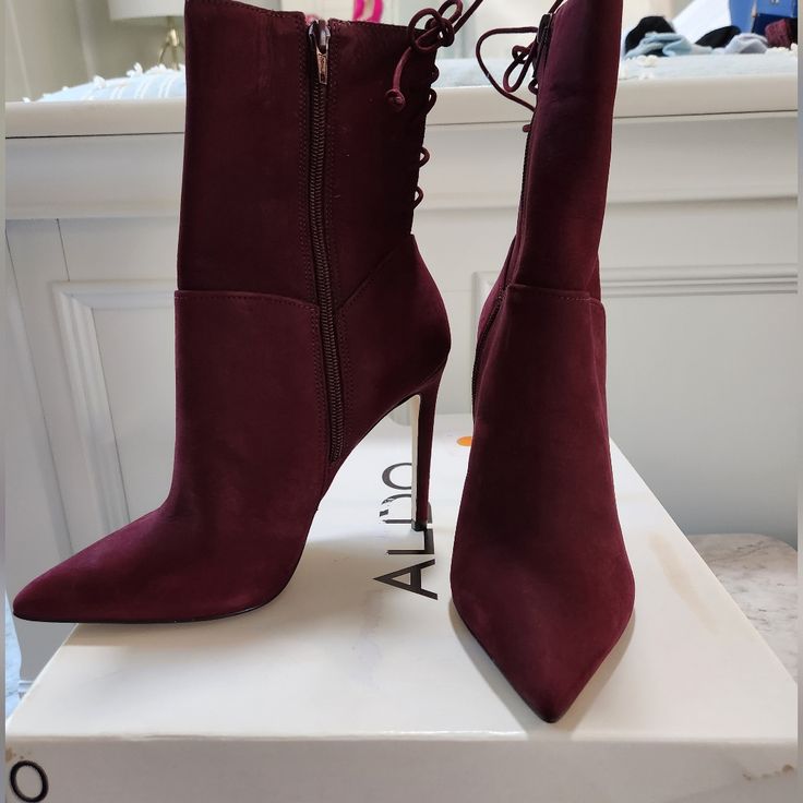 Color Bordeaux Suede, Size 7.5 Never Been Worn Still In Box. Chic Suede Lace-up Heeled Boots, Chic Ankle-high Lace-up Boots Medium Width, Chic Lace-up Suede Booties, Chic Lace-up Suede Heeled Boots, Chic Ankle-high Suede Lace-up Boots, Chic Lace-up Boots With Wrapped Heel, Black Patent Boots, Brown Suede Ankle Boots, Zipper Heels