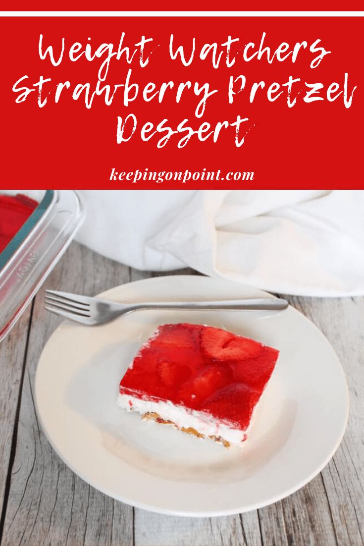 a white plate topped with a slice of strawberry pretzel dessert