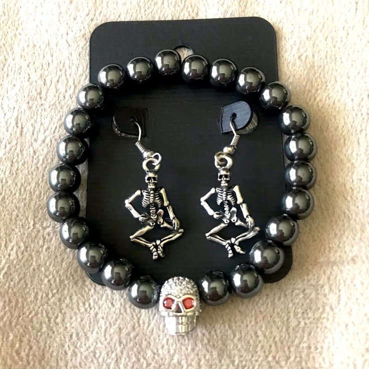 Halloween Skeleton Earrings & Bracelet Set. Full Body Skeleton Earrings With Matching Gun Metal Beaded Bracelet With Rhinestone Skull Head. Get Halloween Ready With This Spooky Set. Punk Alloy Jewelry For Halloween, Black Alloy Halloween Jewelry, Black Alloy Jewelry For Halloween, Punk Skull Jewelry For Halloween, Punk Style Skull Jewelry For Halloween, Punk Stainless Steel Jewelry For Party, Metal Halloween Party Jewelry, Punk Style Stainless Steel Jewelry For Party, Punk Style Stainless Steel Party Jewelry