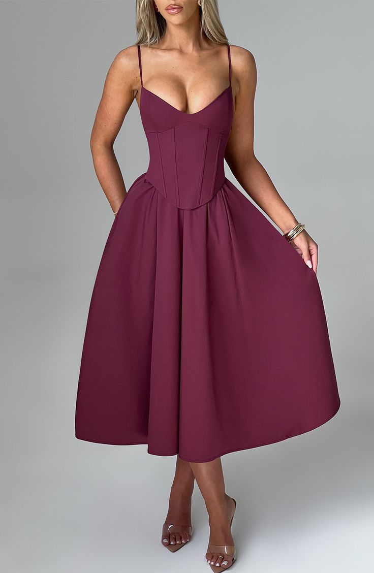 Make an entrance in Mariella, the party midi of your dreams this season. Super feminine and chic, this dress is truly an icon with a structured, corseted bodice that's boned to cinch your waist and contrasted by a full, voluminous skirt. 



Colour: Cherry Lacquer.

Non stretch cotton blend fabric.

Fully lined.

Corseted bodice that's boned to cinch your waist.

Full, voluminous skirt.

Lace up back.

Adjustable straps. Invisible zipper.

Midi length.

 Size: XS, S, M, L, XL, XXL Ruched A-line Midi Dress For Cocktail, Elegant A-line Corset Dress For Spring, Ruched Corset Dress With Sweetheart Neckline For Cocktail, Elegant Ruched Corset Dress For Night Out, Chic Fitted Midi Dress With Corset Back, Spaghetti Strap Corset Dress With Pleated Bodice For Cocktail, Knee-length Corset Dress For Date Night, Spaghetti Strap Ruched Bodice Corset Cocktail Dress, Cocktail Corset Dress With Spaghetti Straps And Ruched Bodice