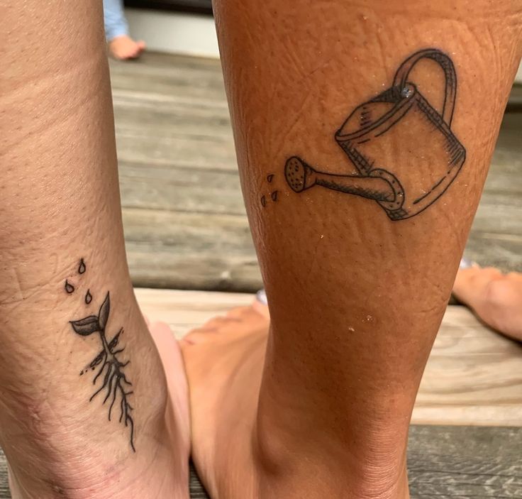 two people with matching tattoos on their legs