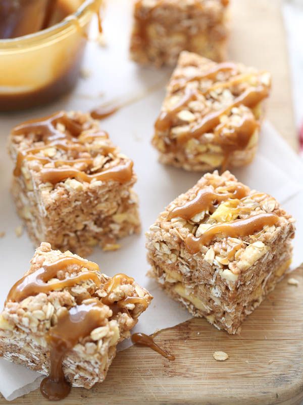 homemade granola bars with peanut butter and caramel drizzled on top