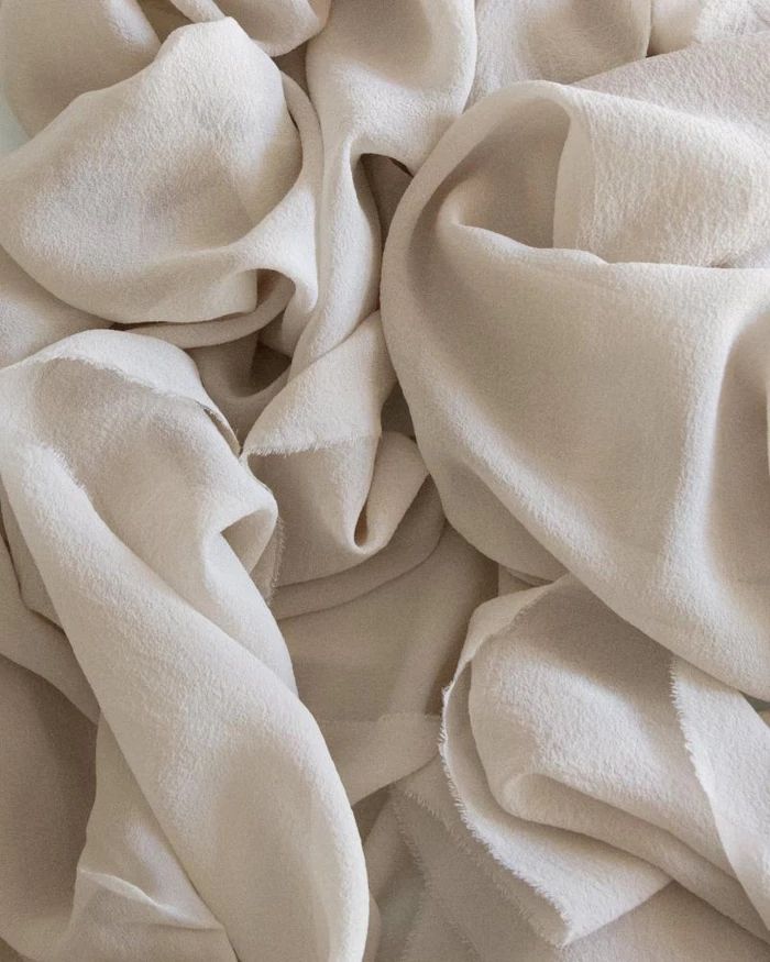 a pile of white fabric on top of each other