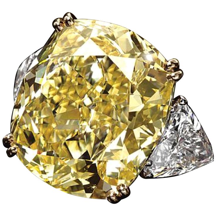 This exquisite ring showcases a stunning 5.09 Carat Cushion Cut Diamond with a GIA Certified Fancy Yellow color grade. The diamond, with an impressive VVS2 Clarity, exhibits exceptional brilliance thanks to its Excellent Polish and Symmetry. The Faint Fluorescence subtly enhances its natural beauty. The ring's unique design features an 18K white gold band, providing a strong and elegant foundation, while the yellow gold prongs beautifully highlight the vibrant yellow hue of the central stone. Fl Fancy Yellow Diamond Ring, Radiant Diamond Rings, Cushion Diamond Ring, Yellow Cushion, Yellow Diamonds Engagement, Cushion Cut Diamond Ring, Yellow Diamond Engagement Ring, Art Investment, Yellow Diamond Rings