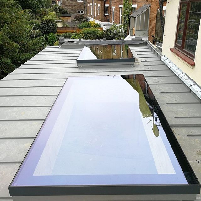 a flat roof with a skylight on it