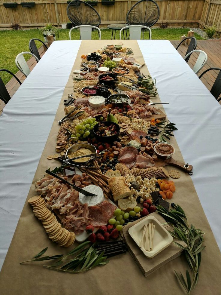 a long table covered with food and utensils