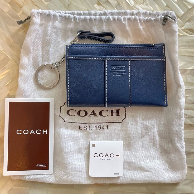 New With Tags Coach Zip Card Case With Coach Badge Navy Blue Leather With Silver Hardware Zip-Top Closure, Fabric Lining Attached Split Key Ring Sport Calf Leather, The Mini Skinny Keeps Keys, Cards And Other Small Essentials Secure. A Slim Design That Slips Easily Into Pockets. 4 1/4" (L) X 3" (H) X 1/2" (W) Mini Skinny Id Case Card Holder Credit Card Business Card Zip Pouch Slg Small Leather Goods Blue Rectangular Rfid Blocking Bag, Elegant Blue Coach Wallet, Blue Coach Wallets With Card Slots, Blue Coin Purse With Removable Pouch For Everyday, Blue Bag With Coin Pocket For Daily Use, Classic Blue Bags With Card Slots, Blue Casual Wallets With Rfid Blocking, Casual Blue Wallets With Rfid Blocking, Blue Leather Coach Wallet