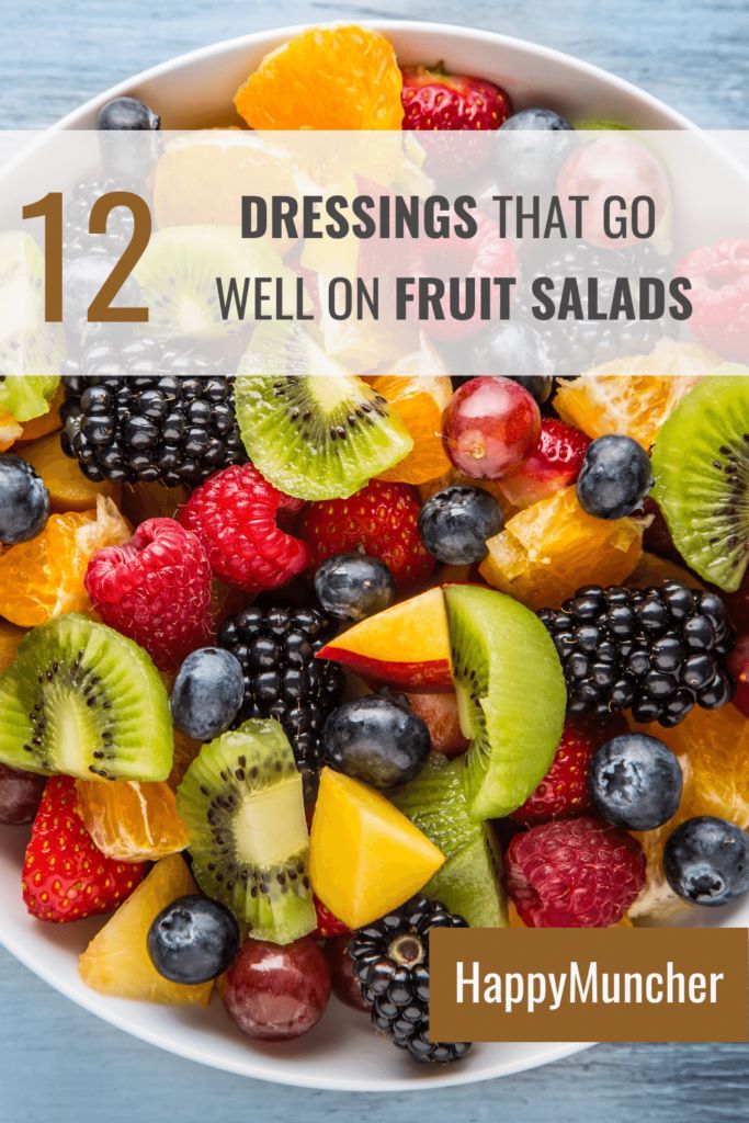 a white bowl filled with fruit on top of a blue table next to the words 12 dressings that go well on fruit salads