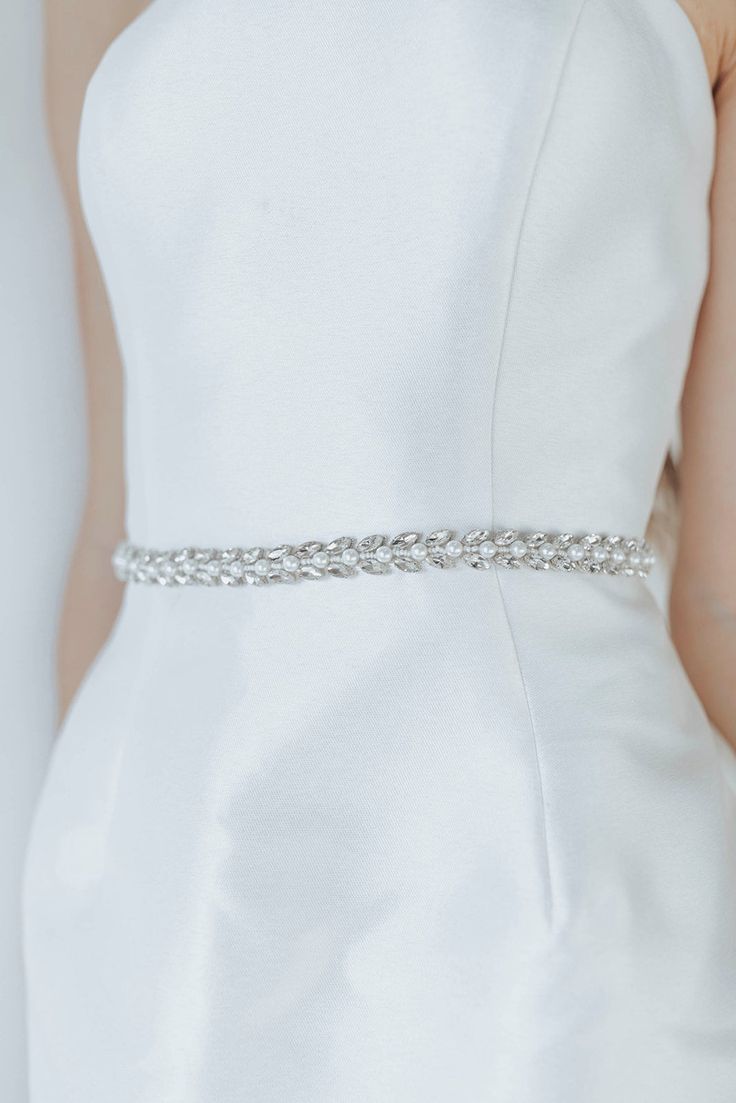 Beautiful clustered pearls and crystals on ribbon ties. We love this modern but classic design. Elegant Silver Embellished Bridal Belt, Elegant Silver Bridal Accessories With Crystal, Elegant Silver Crystal Bridal Accessories, Elegant Bedazzled Bridal Belt For Wedding, Elegant Crystal Bridal Accessories For Formal Occasion, Elegant Crystal Bridal Accessories For Anniversary, Silver Fitted Bridal Belt For Formal Occasions, Elegant Jewelry With Ribbon For Wedding, White Crystal Bridal Accessories For Formal Occasions