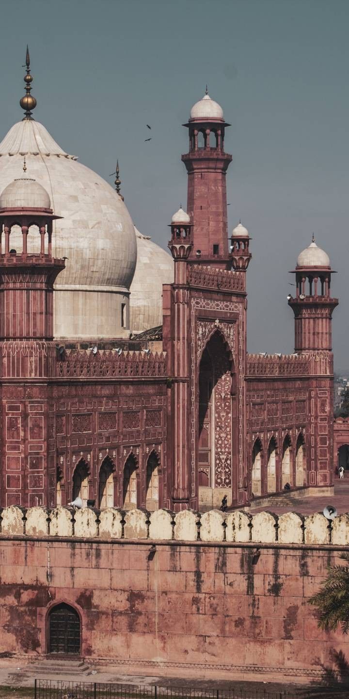 an old building with two towers and domes