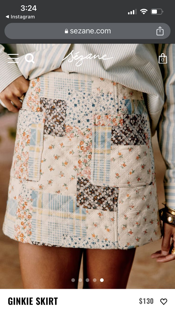 a close up of a woman's skirt with patches and flowers on the side