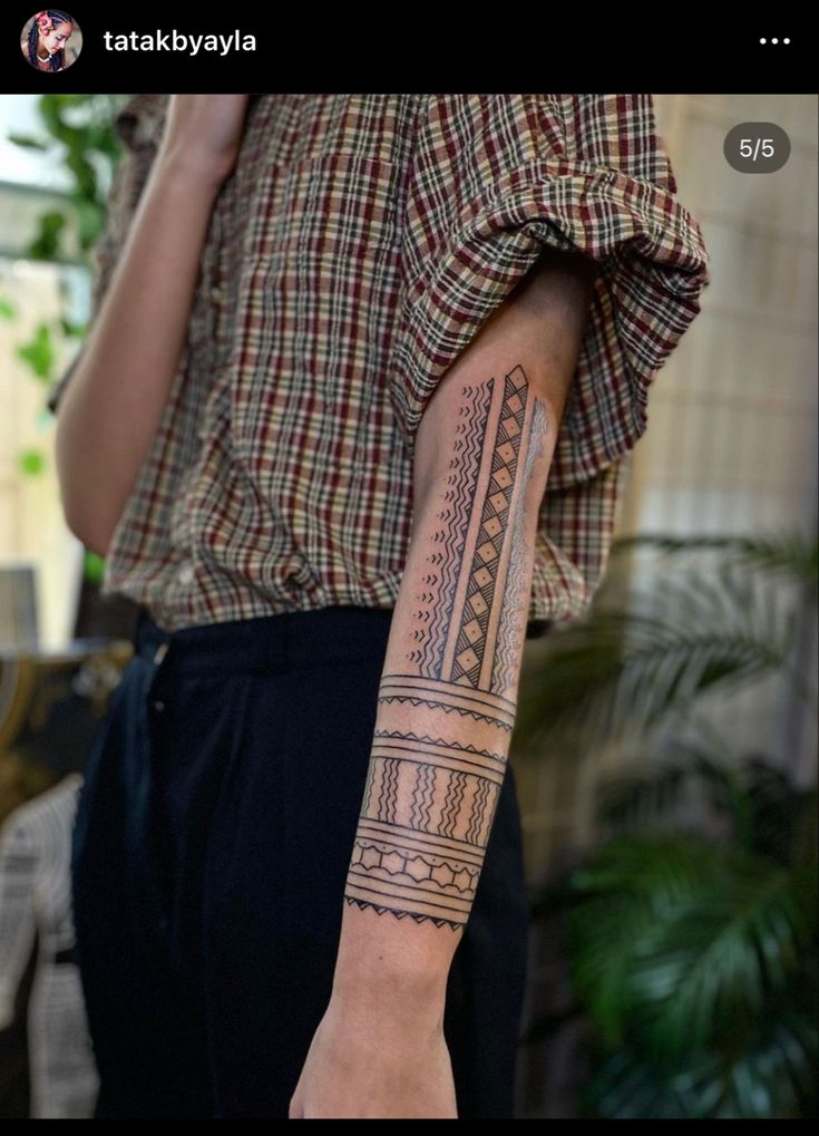 a person with a tattoo on their arm