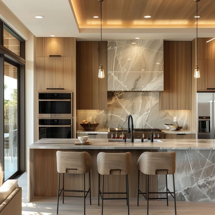 a modern kitchen with marble counter tops and wooden cabinets, along with bar stools