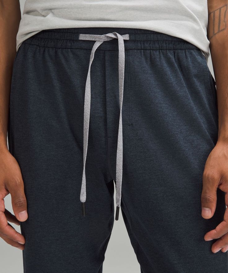 Softness starts here. These lightweight joggers have a brushed interior that makes downtime irresistible. Designed for Casual. Streamlined fit that skims glutes and thighs, then tapers to hem:Intended to sit at ankle for 32"-34" inseam. Hand pockets with hidden phone and coin sleeves. Zippered back pocket. Waistband drawcord can be worn inside or out. Lululemon Stretch Pants For Loungewear, Lululemon Stretch Lounge Pants, Lululemon Cotton Bottoms With Elastic Waistband, Lululemon Stretch Bottoms For Loungewear, Lululemon Athleisure Bottoms With Ribbed Waistband, Lululemon Casual Sweatpants With Elastic Waistband, Lululemon Relaxed Fit Loungewear Bottoms, Lululemon Activewear With Elastic Waistband For Loungewear, Lululemon Athleisure Bottoms For Loungewear