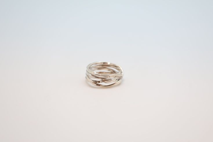 Indulge in luxury with our Weave Ring, handcrafted by Plata. This stunning silver ring features a delicate weaving design, adding a touch of sophistication to any ensemble. Elevate your style and make a statement with our exclusive piece. Elegant Handmade Silver Midi Rings, Elegant Handmade Midi Promise Rings, Silver Stackable Rings With Modern Twist For Wedding, Elegant Handmade Midi Rings For Anniversary, Elegant Silver Infinity Midi Rings, Handmade Elegant Silver Stackable Rings, Handmade Sterling Silver Midi Rings, Handmade Elegant Sterling Silver Midi Rings, Elegant Handmade Sterling Silver Midi Rings