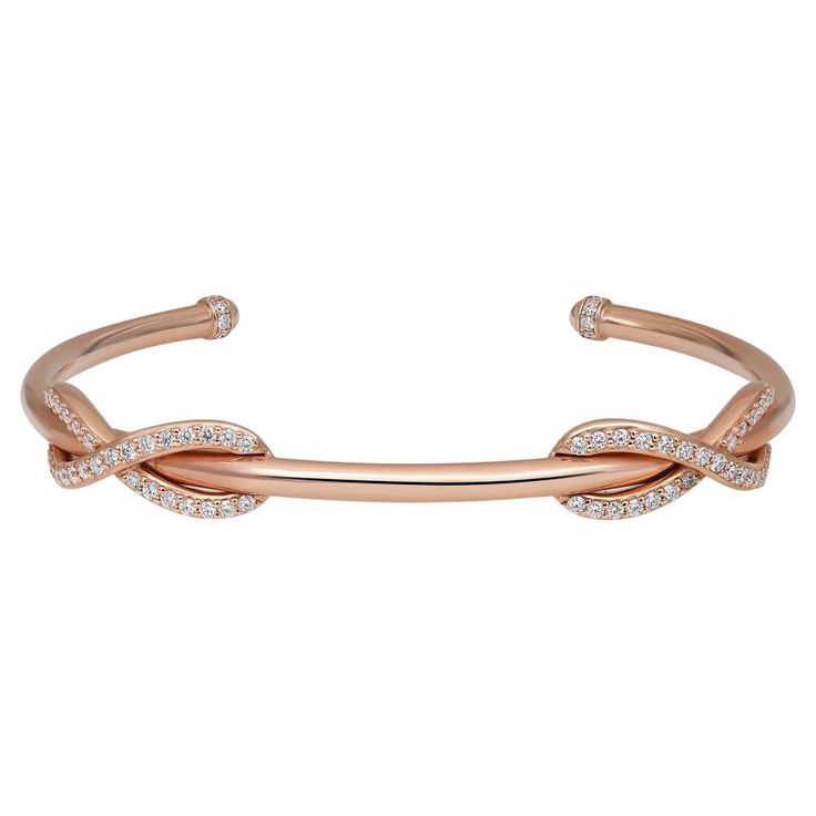 This gorgeous Tiffany & Co. cuff bracelet is crafted in solid 18K rose gold. It features a double infinity design encrusted with bright white round brilliant cut diamonds with exceptional brilliance. This bracelet has a wonderful highly polished finish throughout and is further adorned with additional diamond accents at each end of this cuff bracelet. Total diamond weight: 0.65 carats. Diamond quality: color G-H and clarity: VS-SI. Bangle width: 3mm. Wrist fit: 6.5 inches. Total weight: 20.6 gra Tiffany Bangle, Double Infinity, Tiffany And Co Bracelet, Diamond Cuff Bracelet, Tiffany Box, Infinity Design, Double Diamond, Diamond Bangles Bracelet, Tiffany And Co