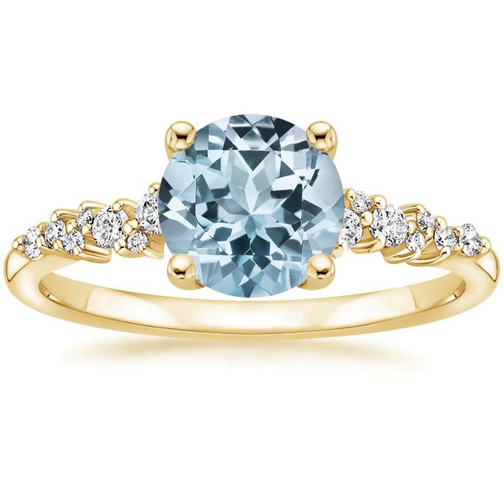 a yellow gold engagement ring with an aqua blue topazte and white diamond accents