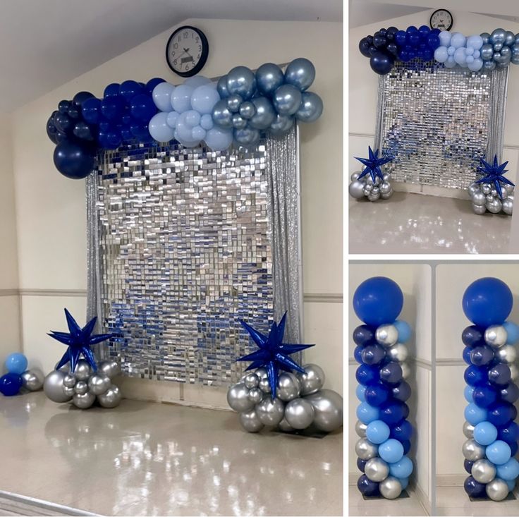 blue and silver balloons are arranged on the wall