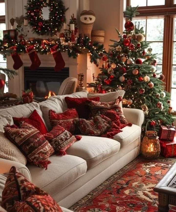 a living room filled with furniture and christmas decorations