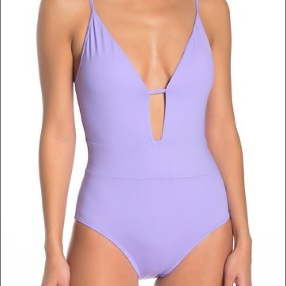 Color : Wisteria A Plunge Front And Scoop Back Add Flirty Style To A Lightly Padded One-Piece Swimsuit. Fit: Swimwear Sizing Is Smaller Than Apparel Sizing; Order One Size Up. - Plunge Neck - Adjustable Straps - Back Ties - Soft Cups - Scoop Back - Lined - Imported Fiber Content 83% Nylon, 17% Spandex Care Hand Wash Cold Additional Info Model's Stats For Sizing: - Height: 5'9" - Bust: 34" - Waist: 23" - Hips: 35" Model Is Wearing Size S. Nwot, Never Worn, Sanitary Lining In Place Purple Lined Bodysuit For Vacation, Lavender Swimwear For Spring Pool Time, Purple Beach Bodysuit For Spring, Purple Bodysuit For Spring Beach Outings, Purple Lined Swimwear For Spring, Elegant Purple Swimwear For Vacation, Low-cut Beachwear Swimwear For Spring, Chic Purple Swimwear For Vacation, Purple Bodysuit For Pool In Spring