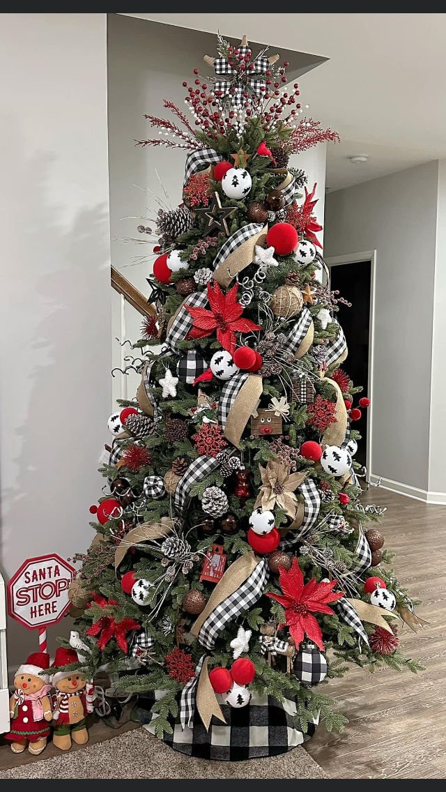 a christmas tree decorated with red, black and white ornaments