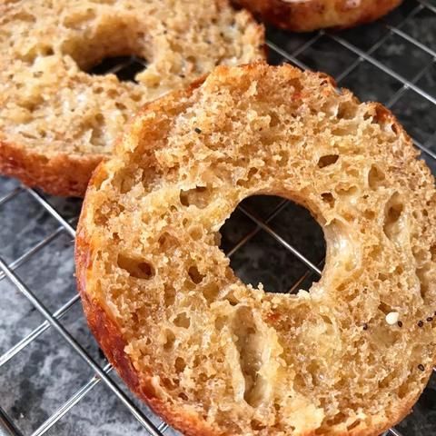 three doughnuts sitting on top of a cooling rack