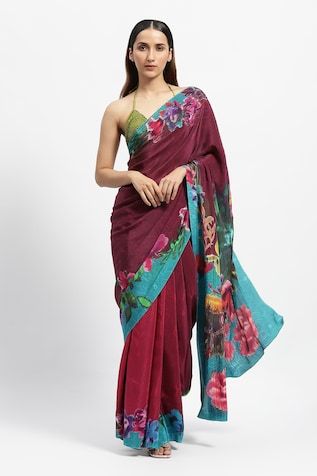 Maroon red saree featuring floral print on the hem and pallu embellished with tikki stones. Comes with a running blouse piece. - Aza Fashions Diwali Red Blouse Piece With Printed Border, Festive Red Blouse Piece With Printed Border, Red Chanderi Blouse Piece With Printed Border, Red Blouse Piece With Printed Border For Saree, Red Bohemian Pre-draped Saree In Traditional Style, Red Cotton Silk Blouse Piece With Kalamkari Print, Unstitched Red Blouse Piece With Kalamkari Print, Festive Kalamkari Print Georgette Blouse Piece, Red Blouse Piece With Printed Motifs For Festivals