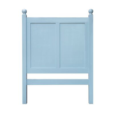 a light blue headboard with two small posts on each side and an open door at the top