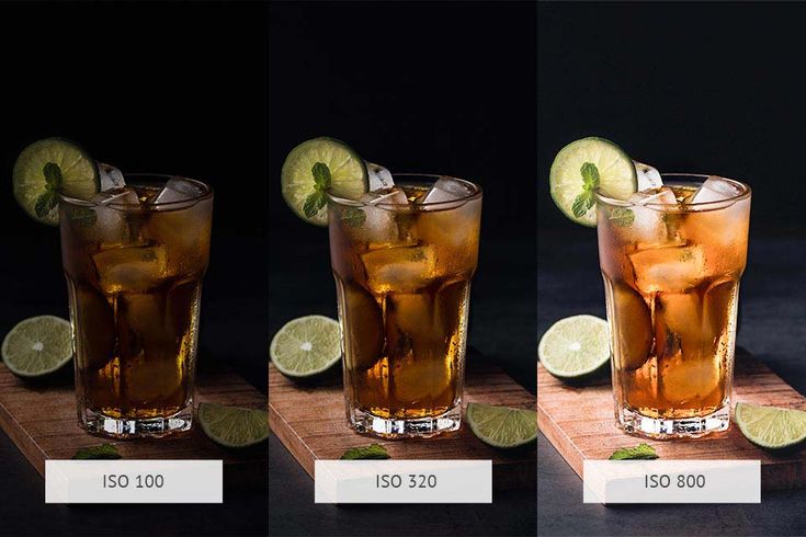 three glasses with different types of drinks and limes on the side, one filled with ice