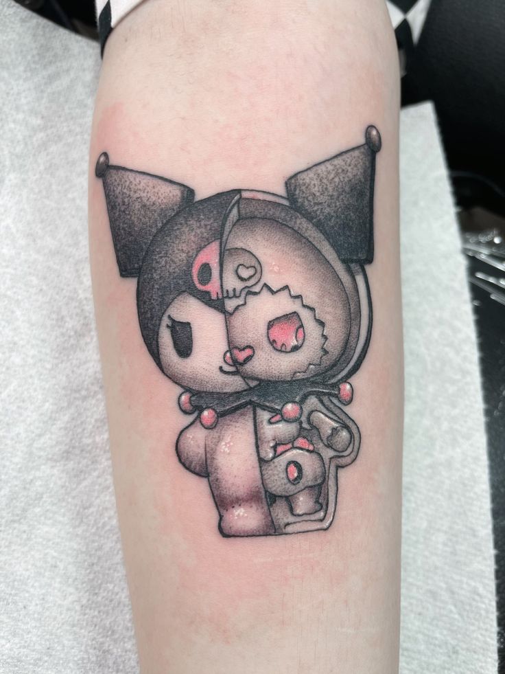 a small tattoo on the leg of a person with a cat and dog in it