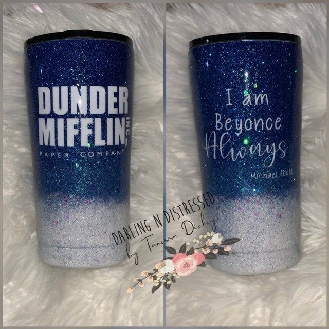 two tumbles that have been decorated with glitter and the words dunder mifflin on them