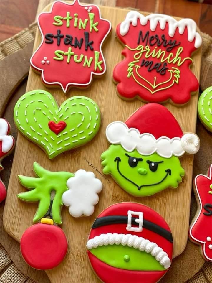 decorated christmas cookies on a wooden platter