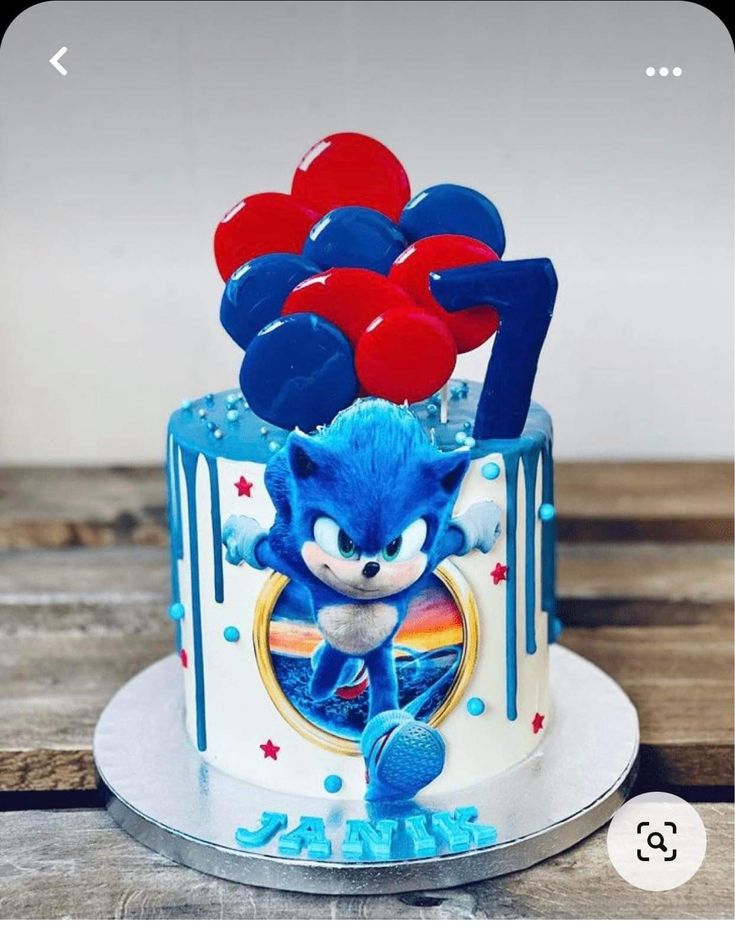 a sonic the hedgehog cake with balloons on top