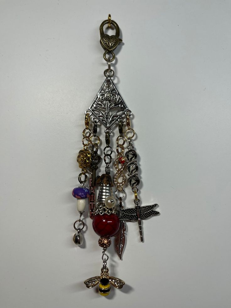 an assortment of charms hanging from a hook