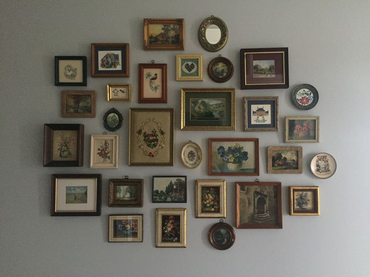 there are many framed pictures on the wall